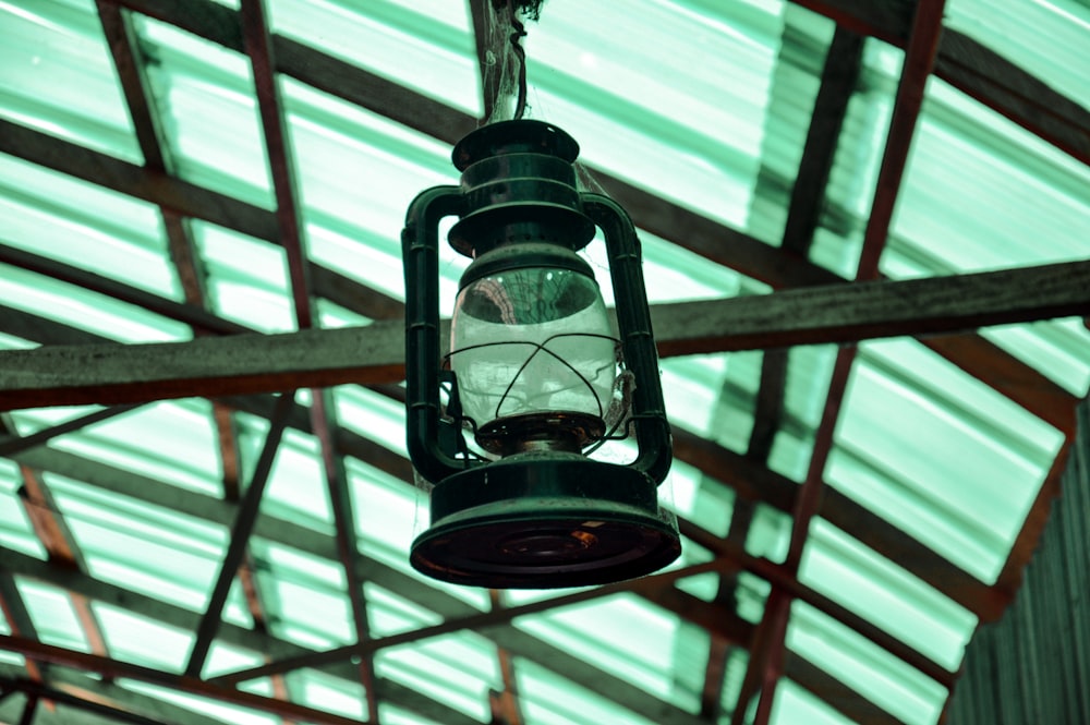 a lantern hanging from the ceiling of a building