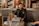 a man sitting at a table with a laptop