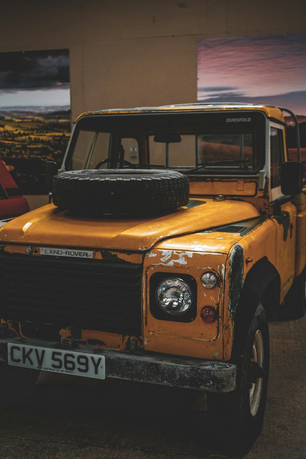 a yellow truck parked in a parking lot