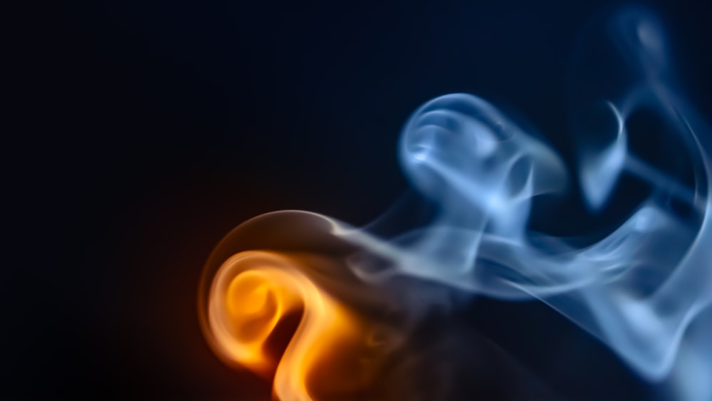 a close up of a blue and yellow smoke