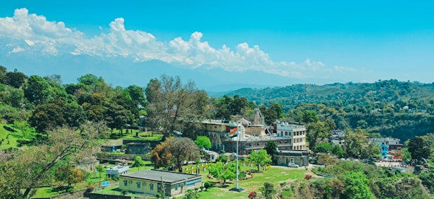 A vibrant collage showcasing iconic Indian landmarks like the Taj Mahal, Kerala backwaters, and Himalayan mountains.