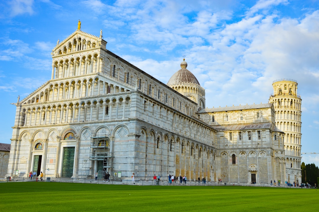 a large white building with a tall tower,