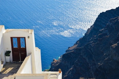 Balcony overlooking the sparkling Adriatic Sea with sunlit waves.