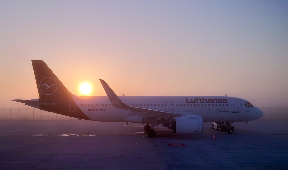 a large jetliner sitting on top of an airport tarmac