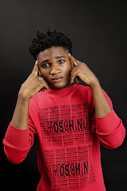 a woman in a red shirt posing for a picture