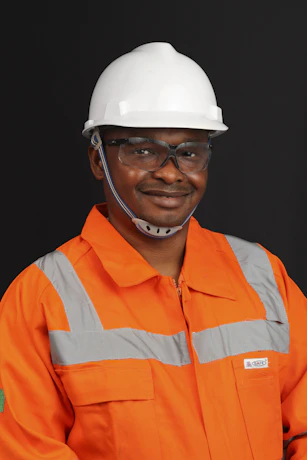 a man wearing a hard hat and safety gear