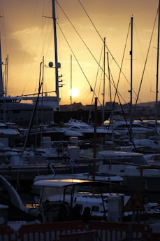 A panoramic view of a marina filled with yachts in Macedonia at sunset.