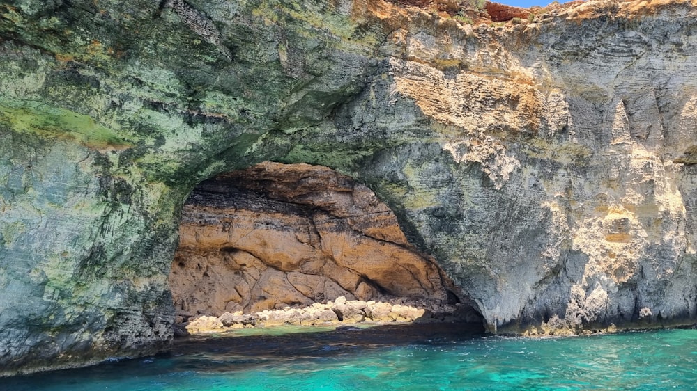 a large rock formation with a cave in the middle of it