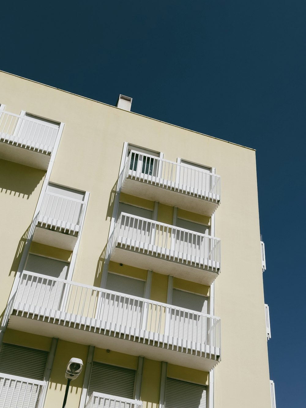 an apartment building with balconies and balconies on the balconies