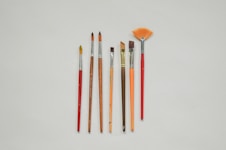 a group of paint brushes sitting next to each other