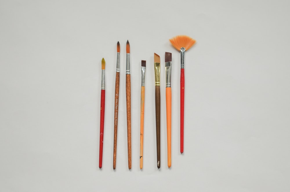 a group of paint brushes sitting next to each other