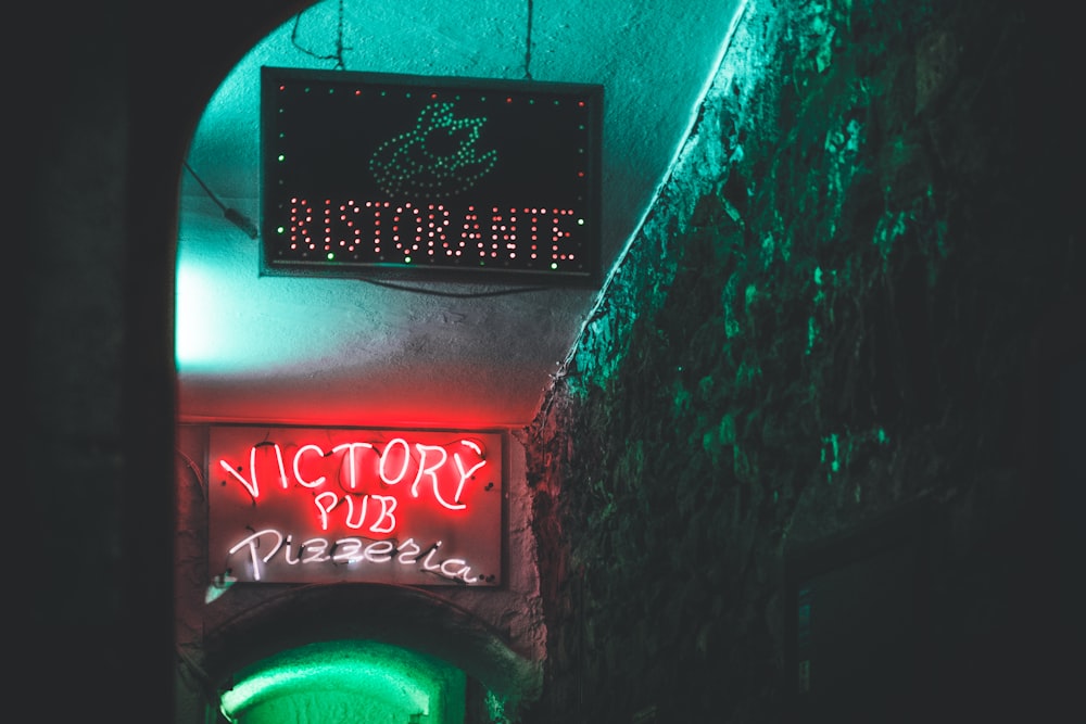 a neon sign on the side of a building