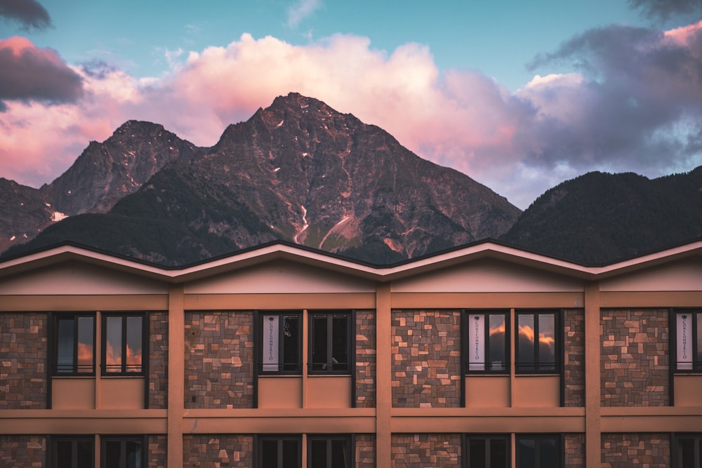 a building with a mountain in the background