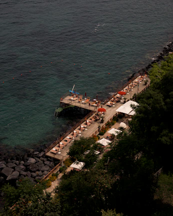 Spacious deck of Neptuns 56 Fly with sun loungers and panoramic sea views