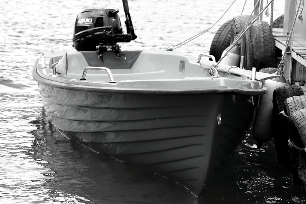 a black and white photo of a boat in the water