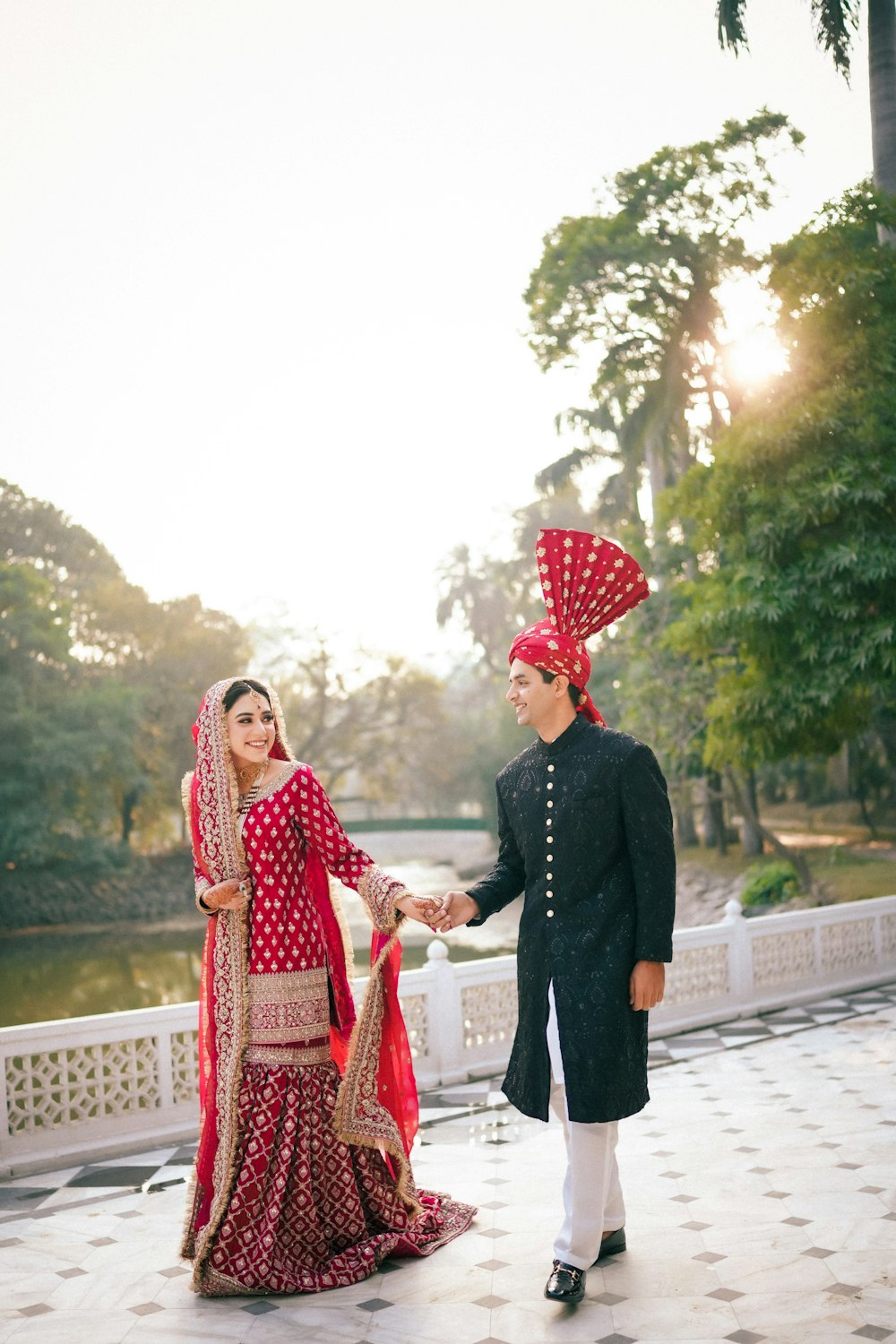 a man and woman dressed in indian attire