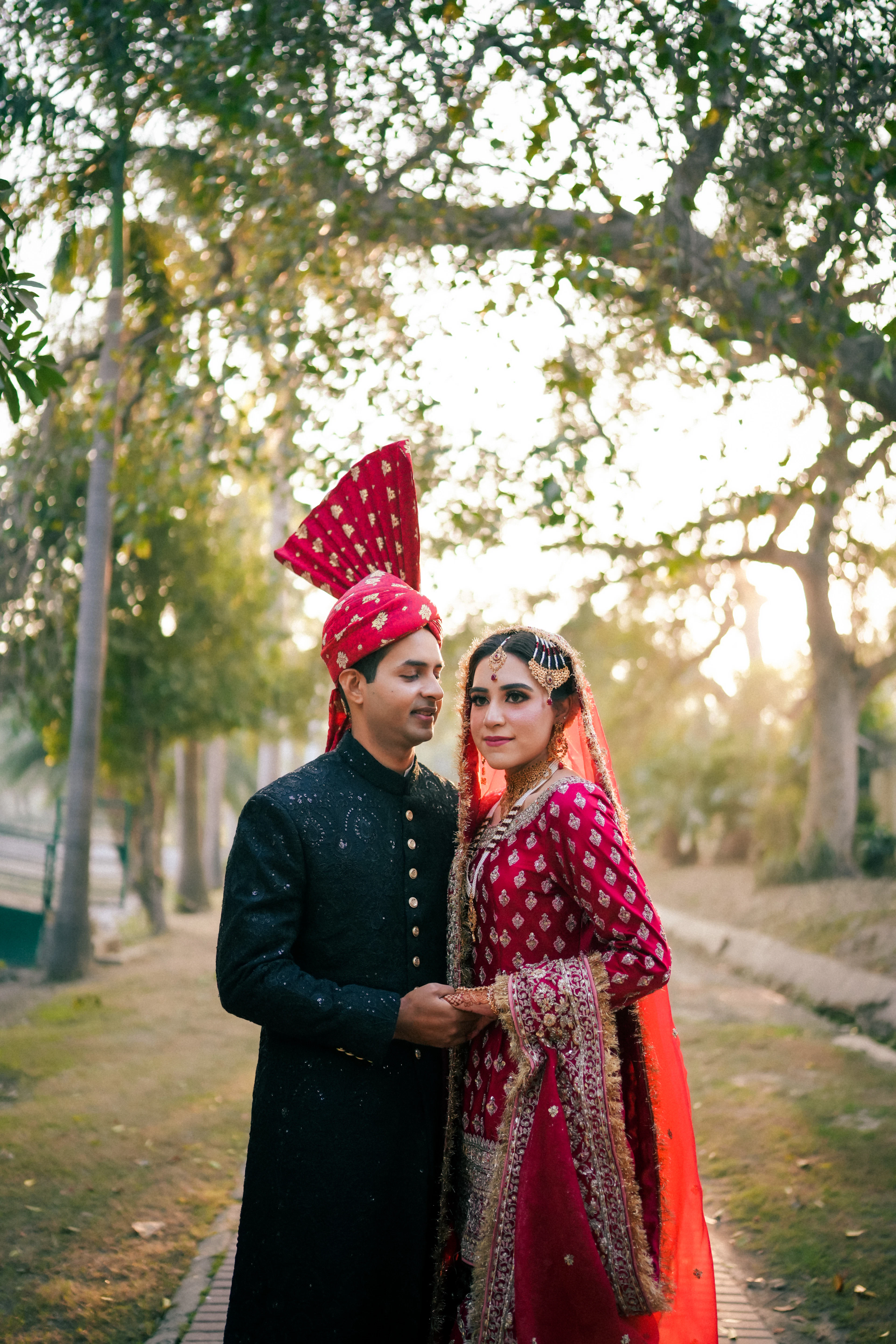 Bride and groom together in a garden