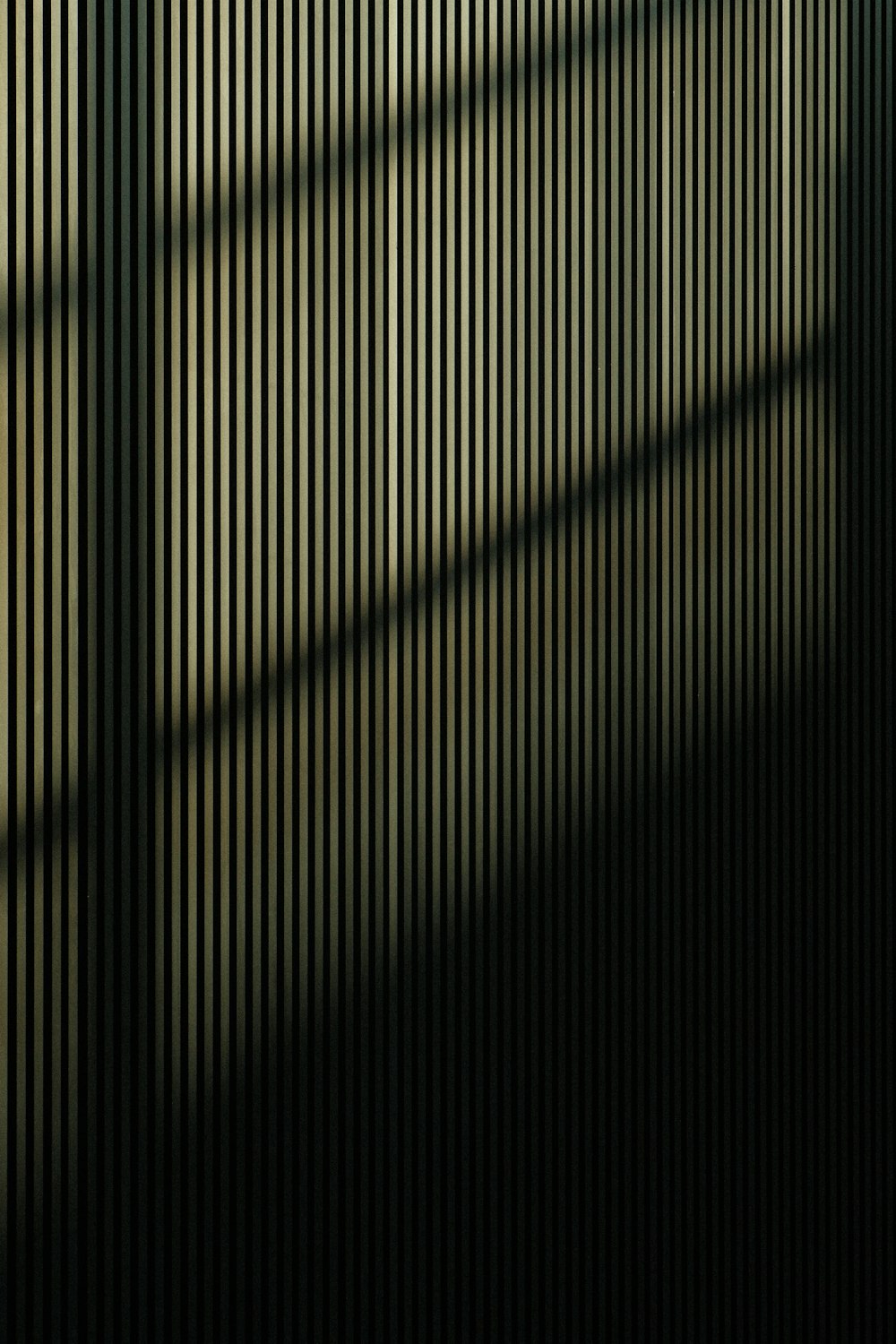 the shadow of a window on a wall