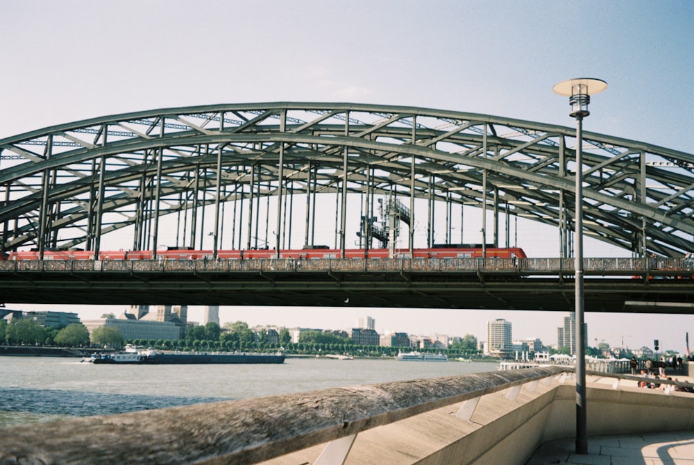 a train on a bridge over a body of water