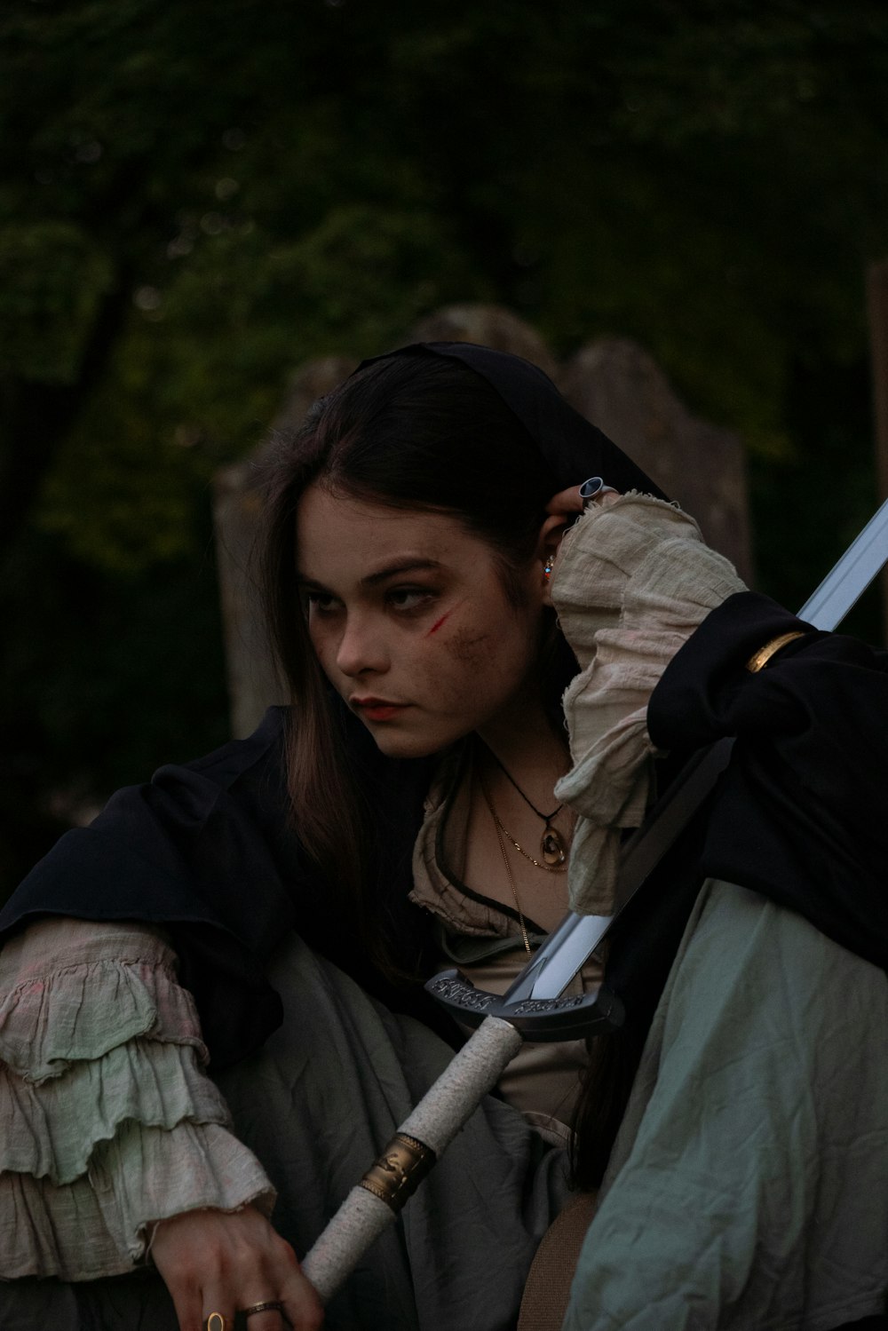 a woman in a costume holding a sword