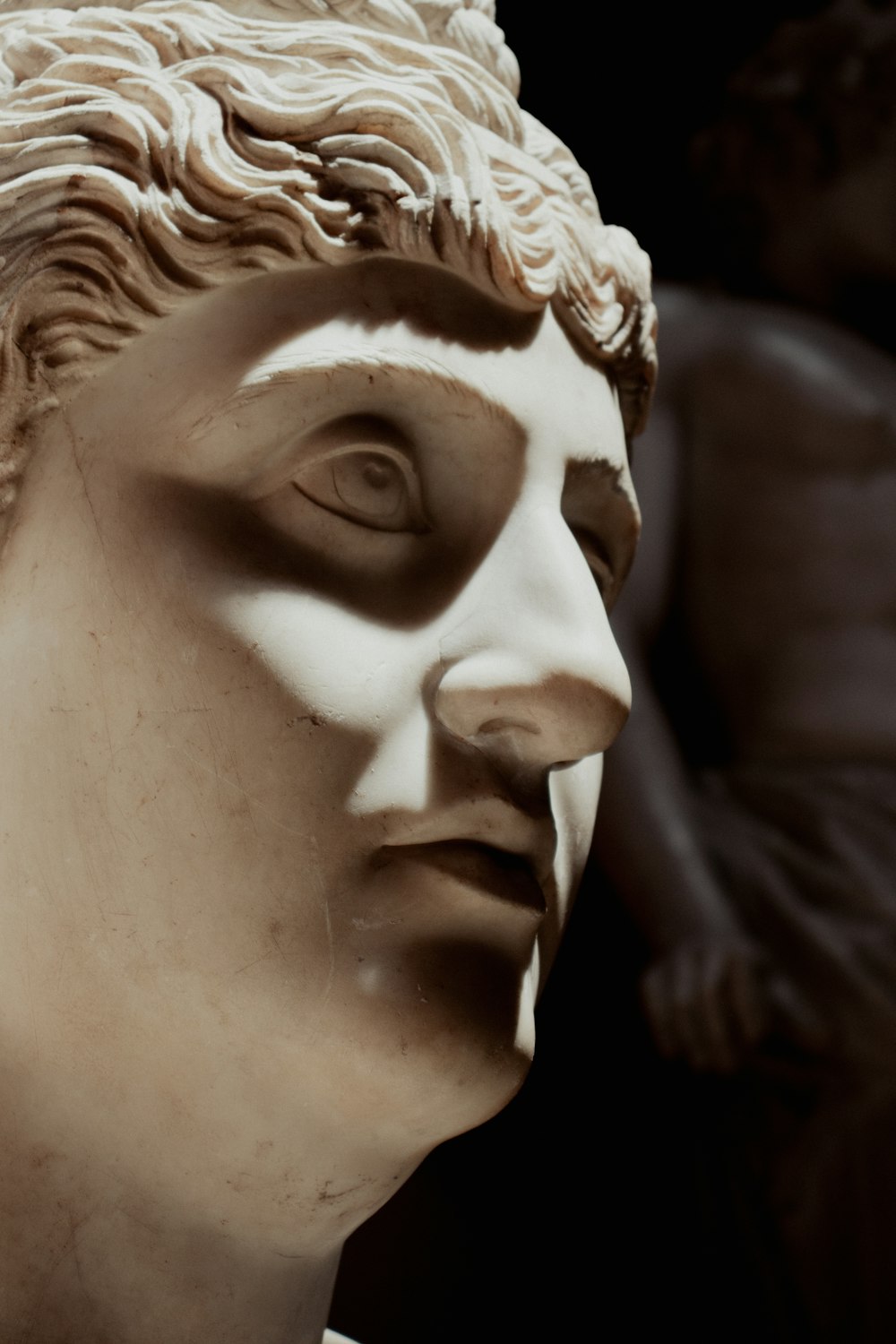 a close up of a statue of a man's face