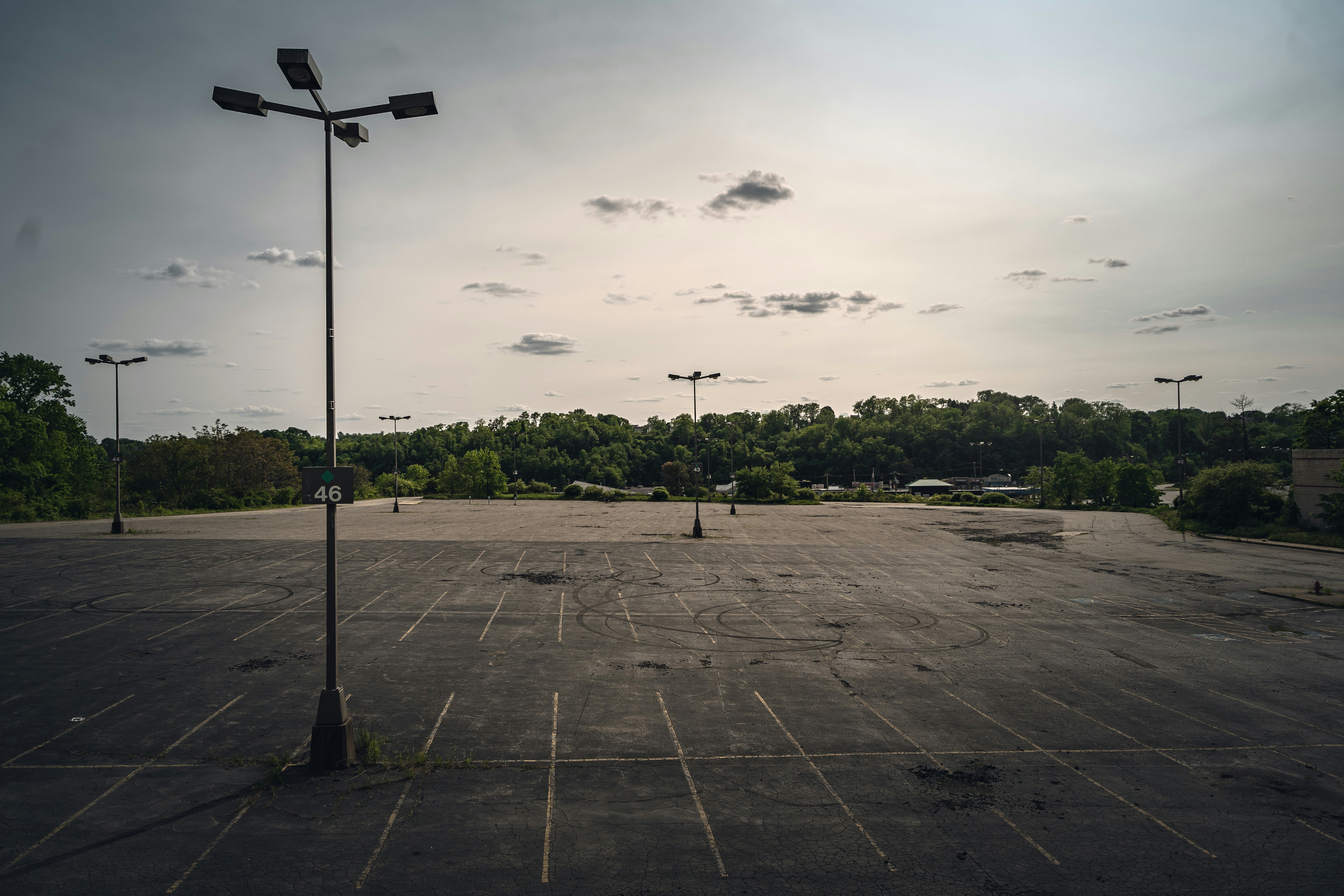 The sealcoating process on a parking lot