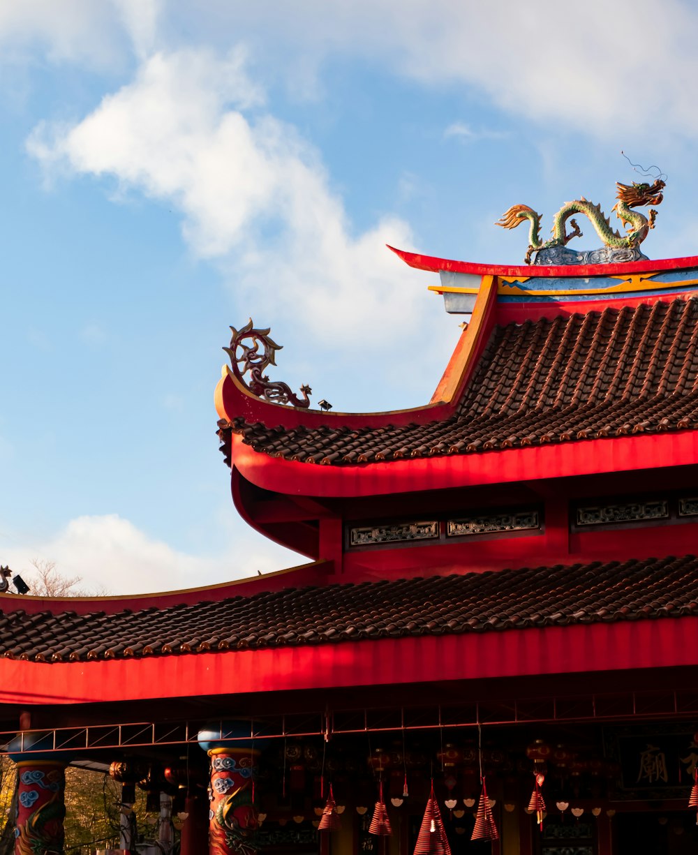 a red building with a dragon on top of it