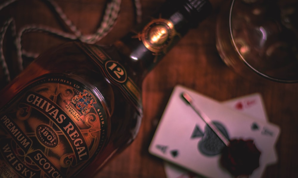 a bottle of alcohol sitting on top of a wooden table