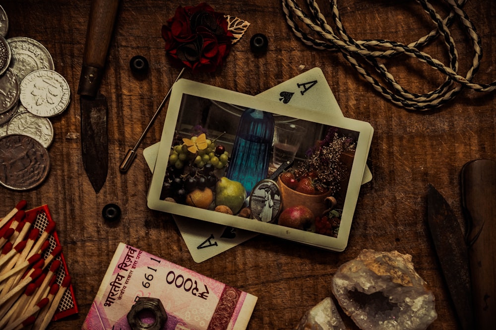 a wooden table topped with lots of different items