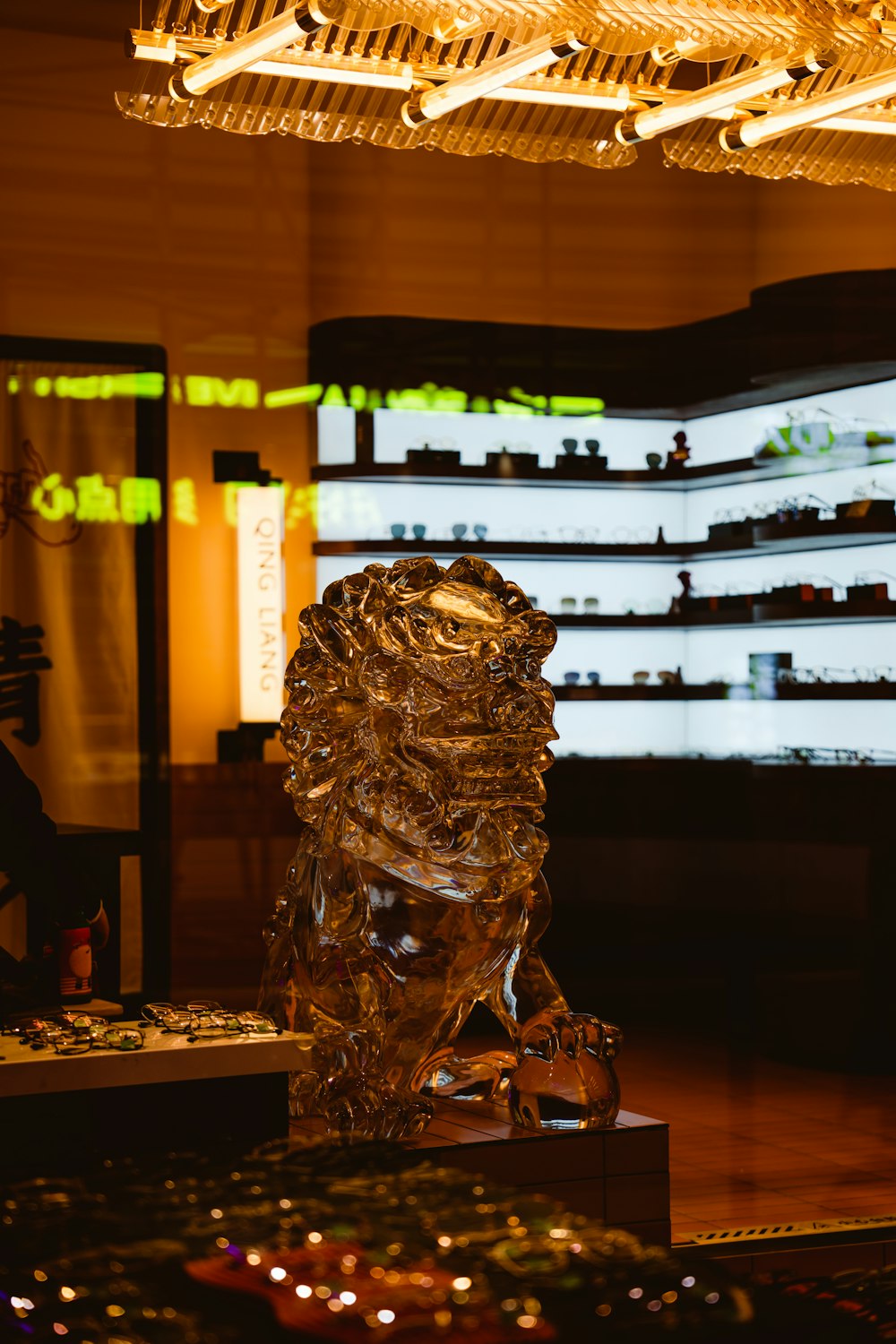 a glass sculpture of a lion in a store