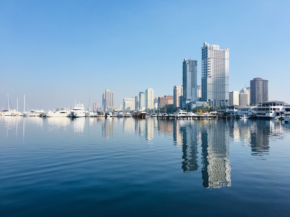 a large body of water with a city in the background