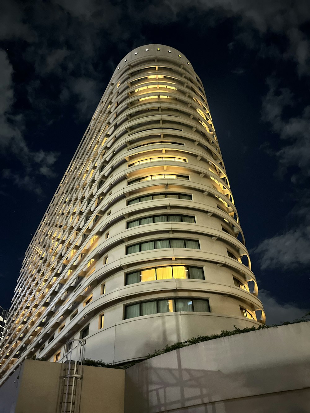 a very tall building lit up at night