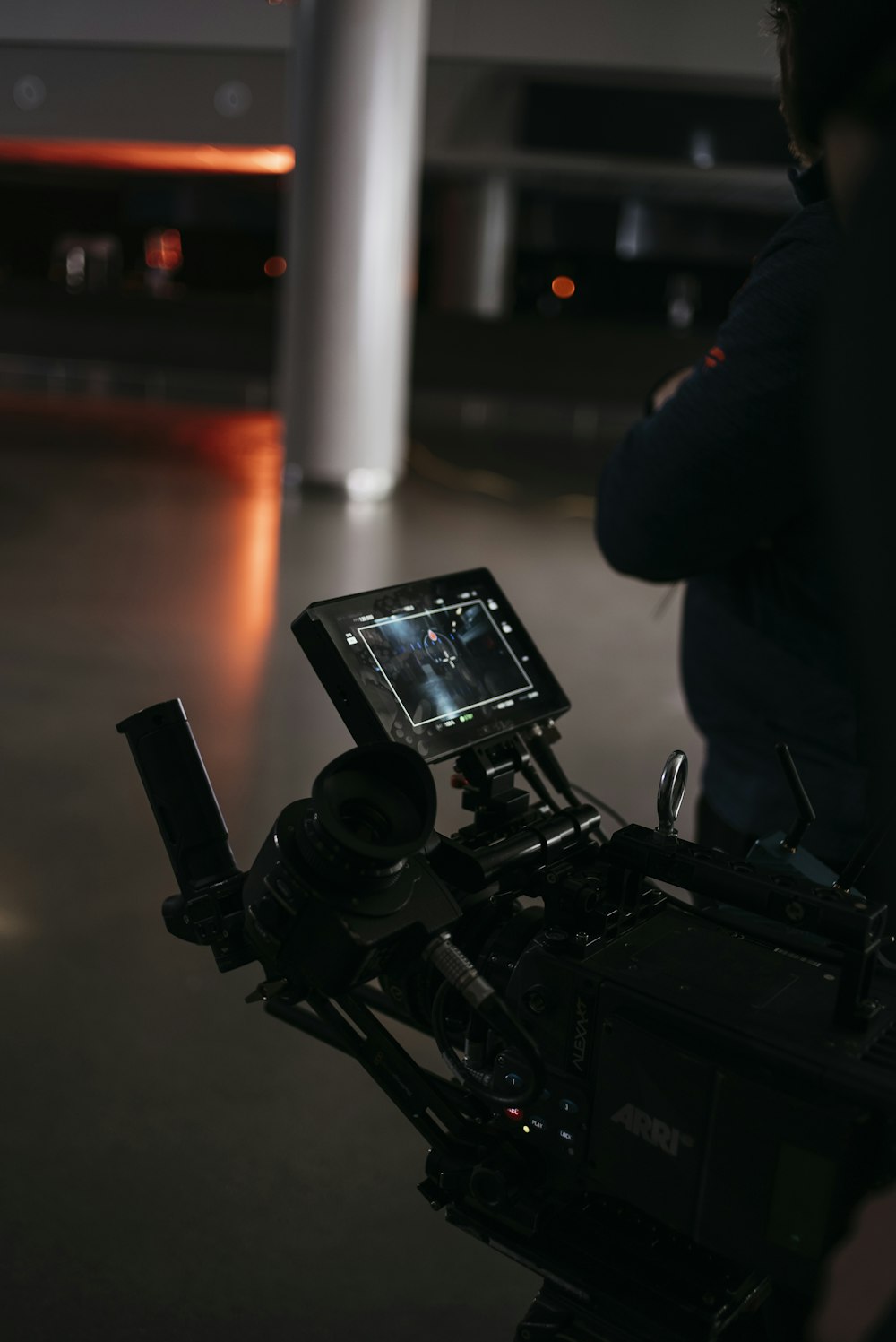 a camera set up on a tripod in a building