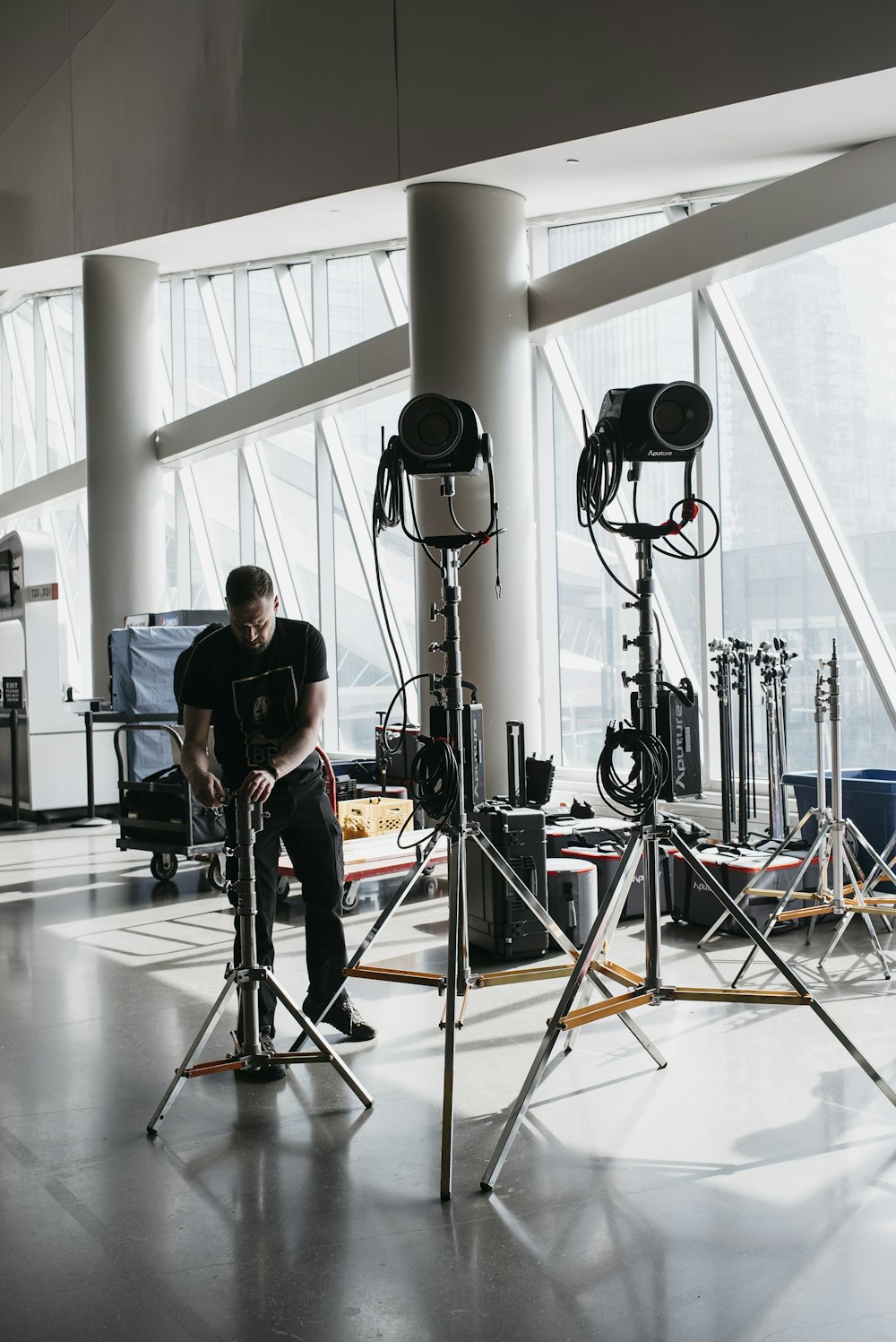 a man sitting on a chair in front of a camera