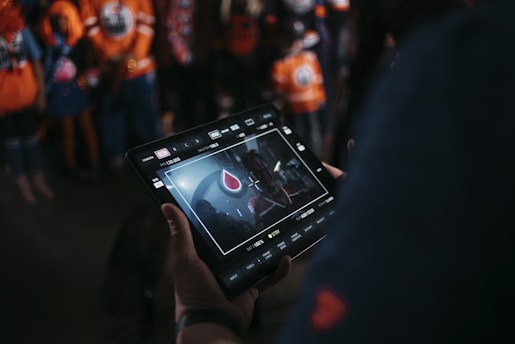A fantasy football team lineup being adjusted on a digital tablet