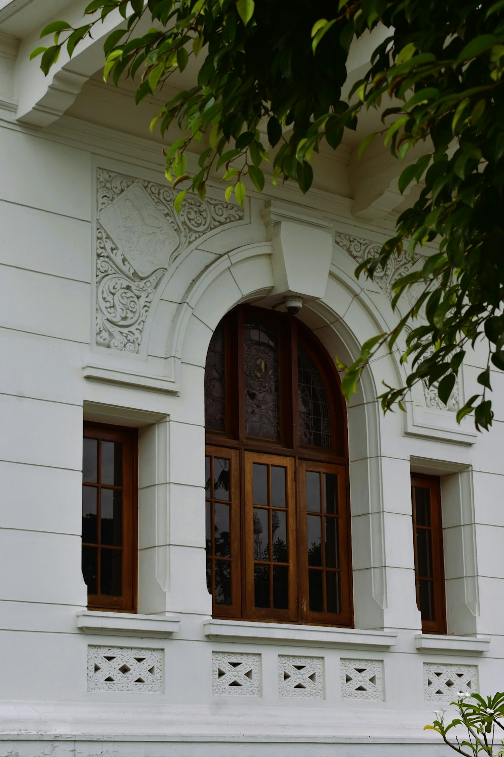 a white building with a clock on the front of it