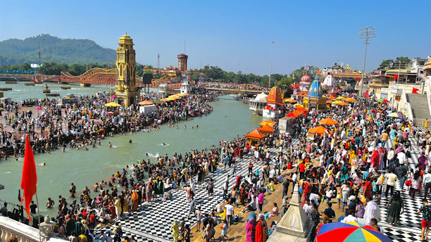 A vibrant crowd at the Maha Kumbh Mela near the sacred river.