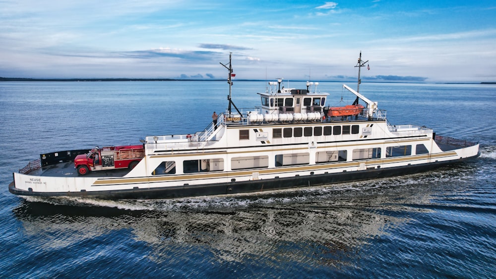 a large white boat traveling across a body of water