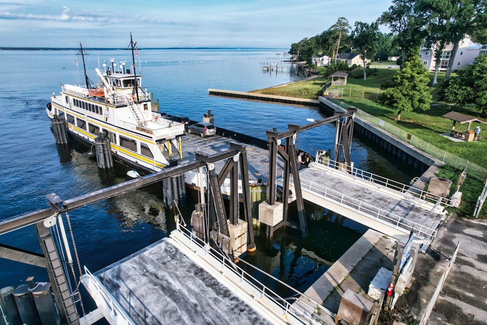 a boat is docked at a pier on the water