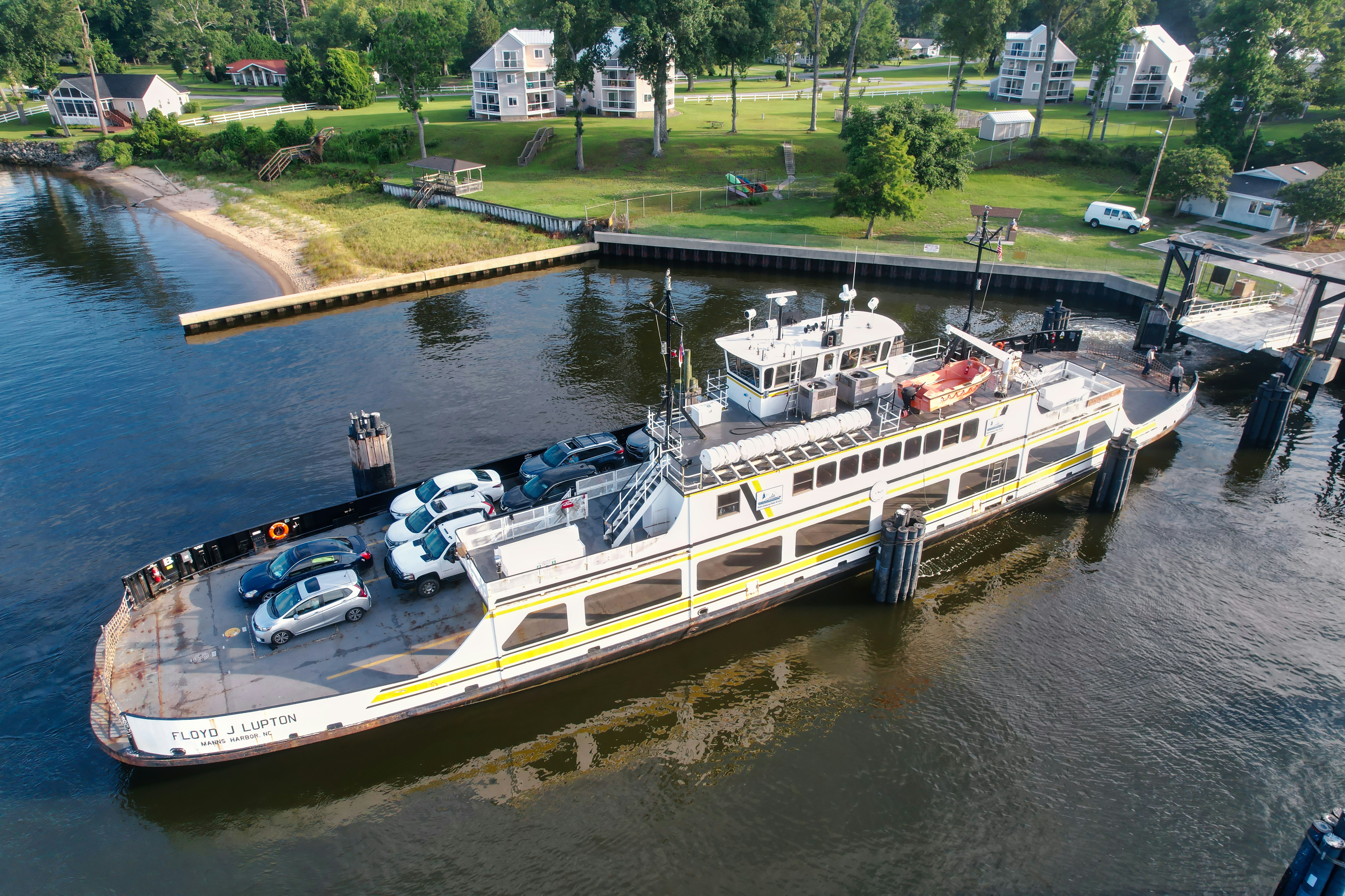 A large boat is docked at a pier photo Free Cherry branchminnesott