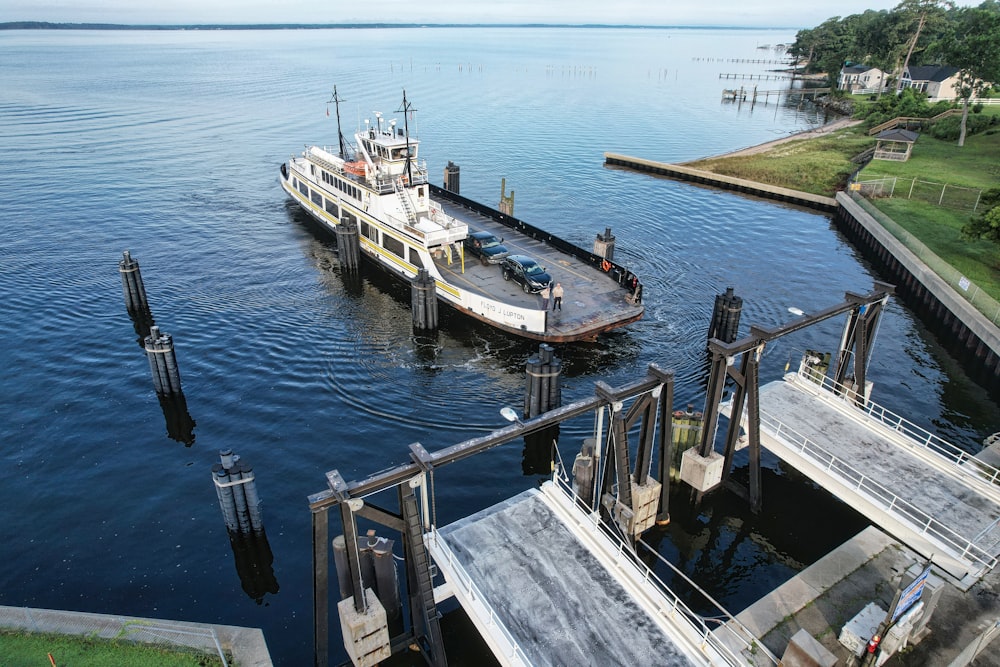 a boat is docked at a pier on the water