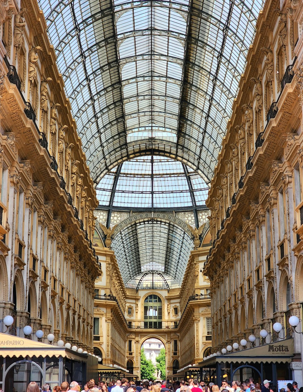 a group of people standing in a large building