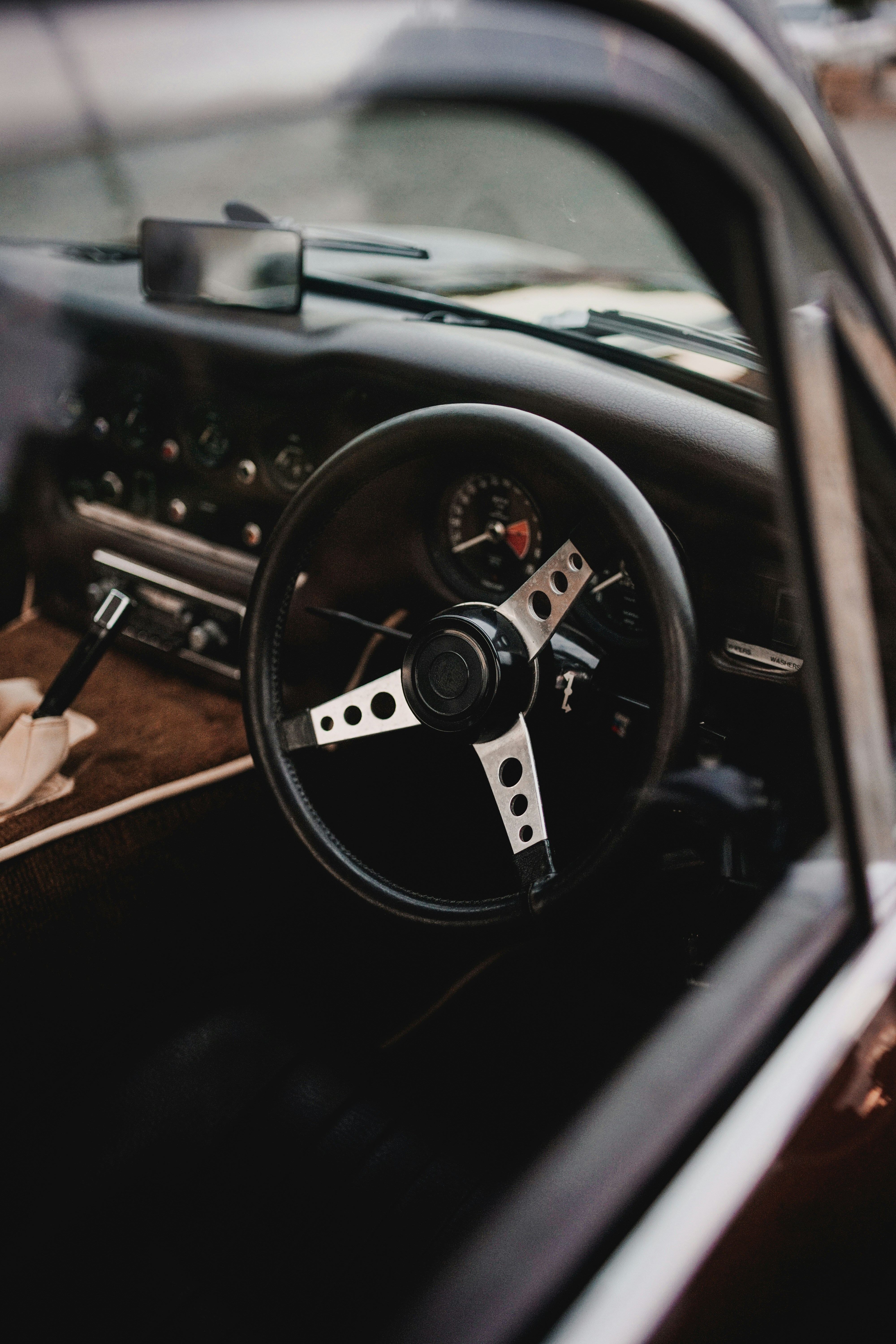 the interior of a car with a steering wheel and dashboard
