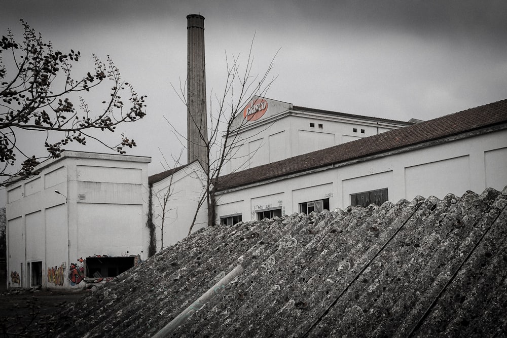 a black and white photo of a factory building