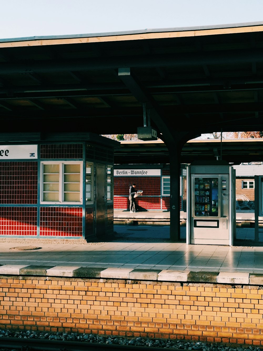 a train station with a train on the tracks