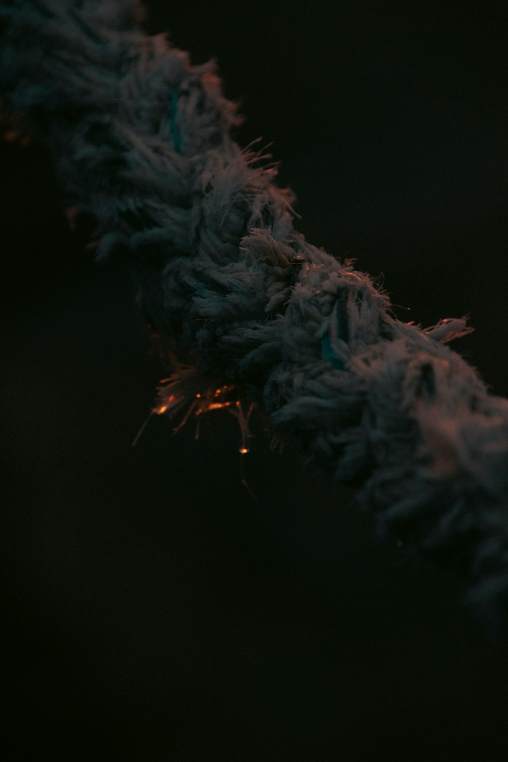 a close up of a rope on a black background