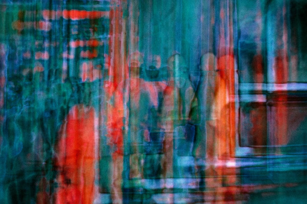 a blurry image of people walking down a street
