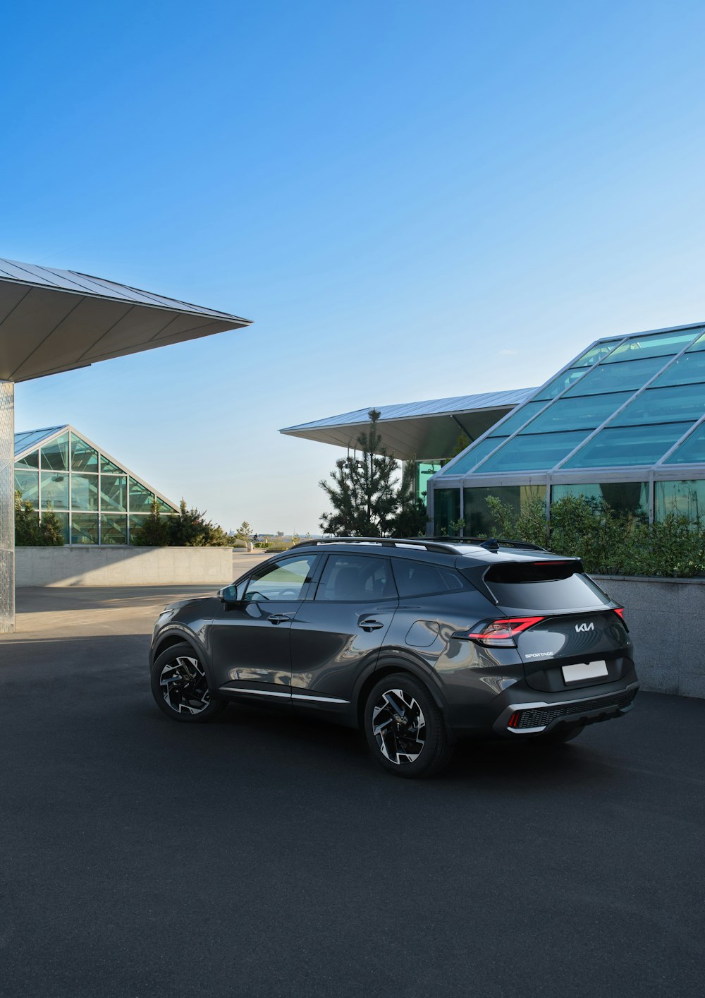 a black car parked in front of a building