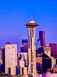 A vibrant city skyline with cranes and construction sites, symbolizing growth.