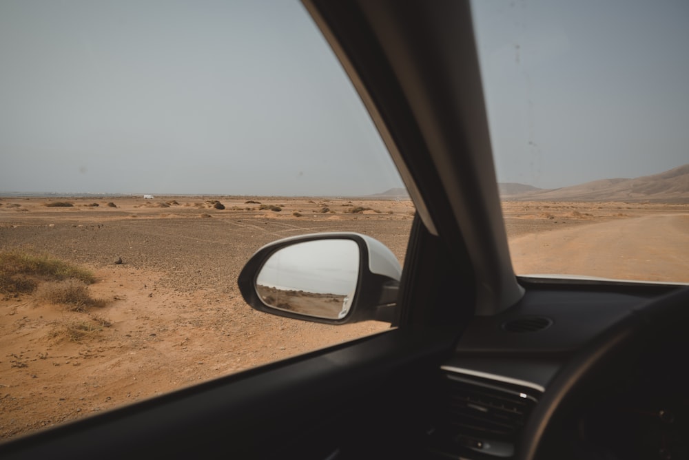a view of a desert from a car window